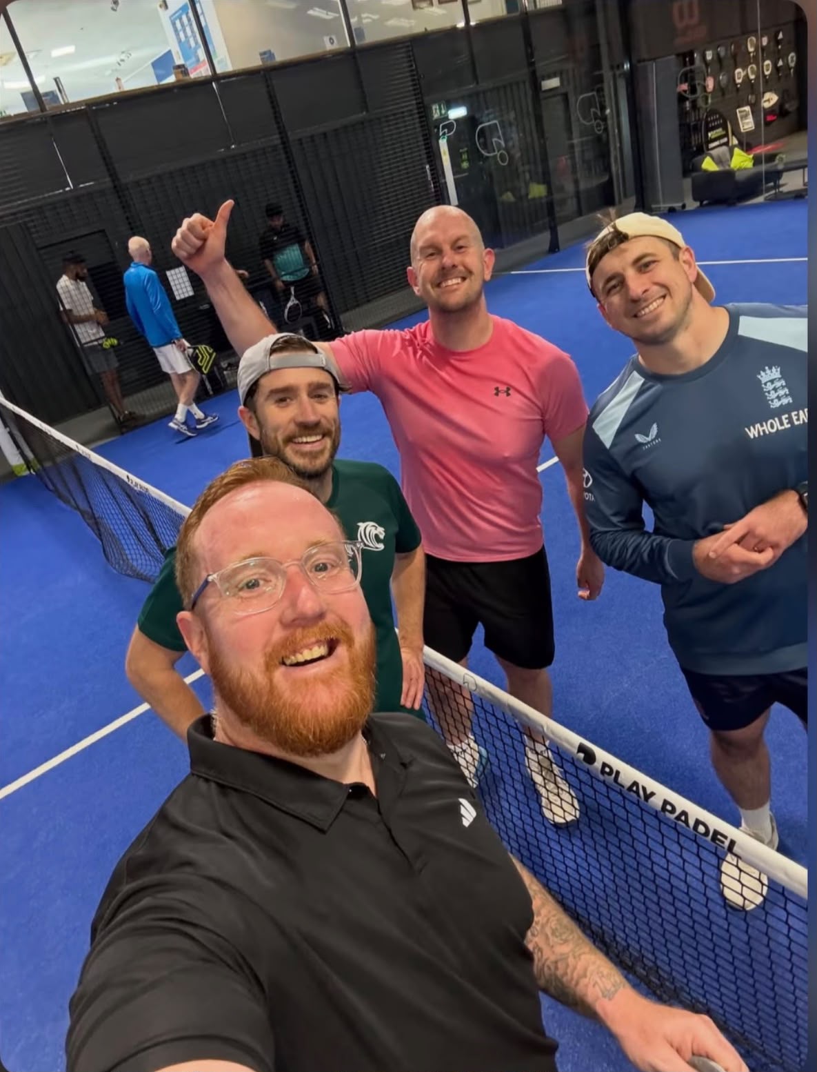 Members taking a selfie on the padel court after their game